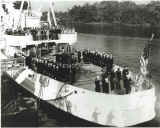 3 Oct 56 CG Yard Chilula commissioned QM3 Larry raising flag.jpg (75351 bytes)